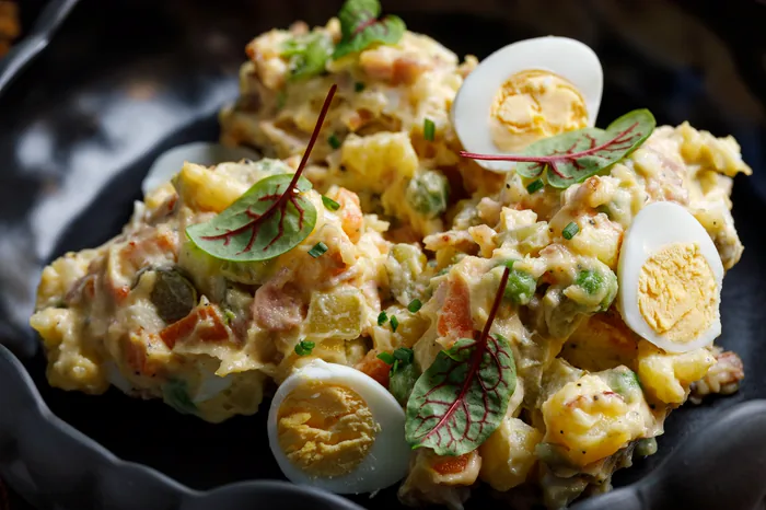 Potato salad with eggs and fresh herbs